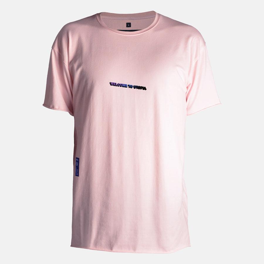 Wearing shot of Welcome to Utopia tshirt in soft pink