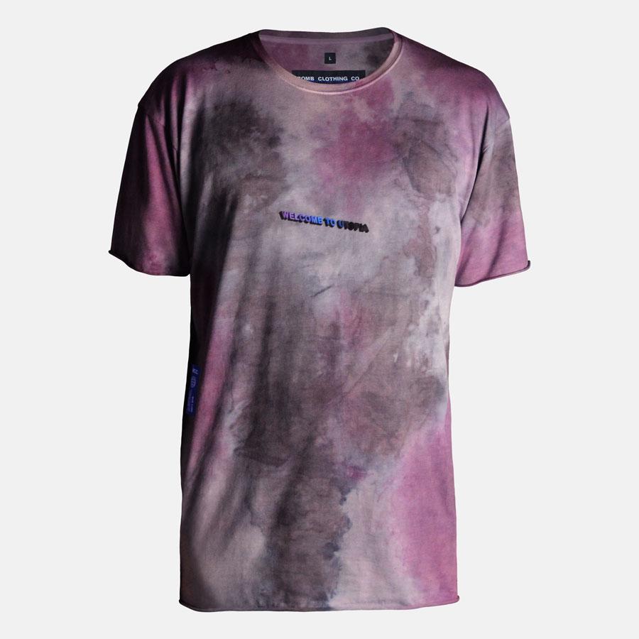Detailed wearing shot of back Welcome to Utopia screen print on hand dyed tshirt in purple